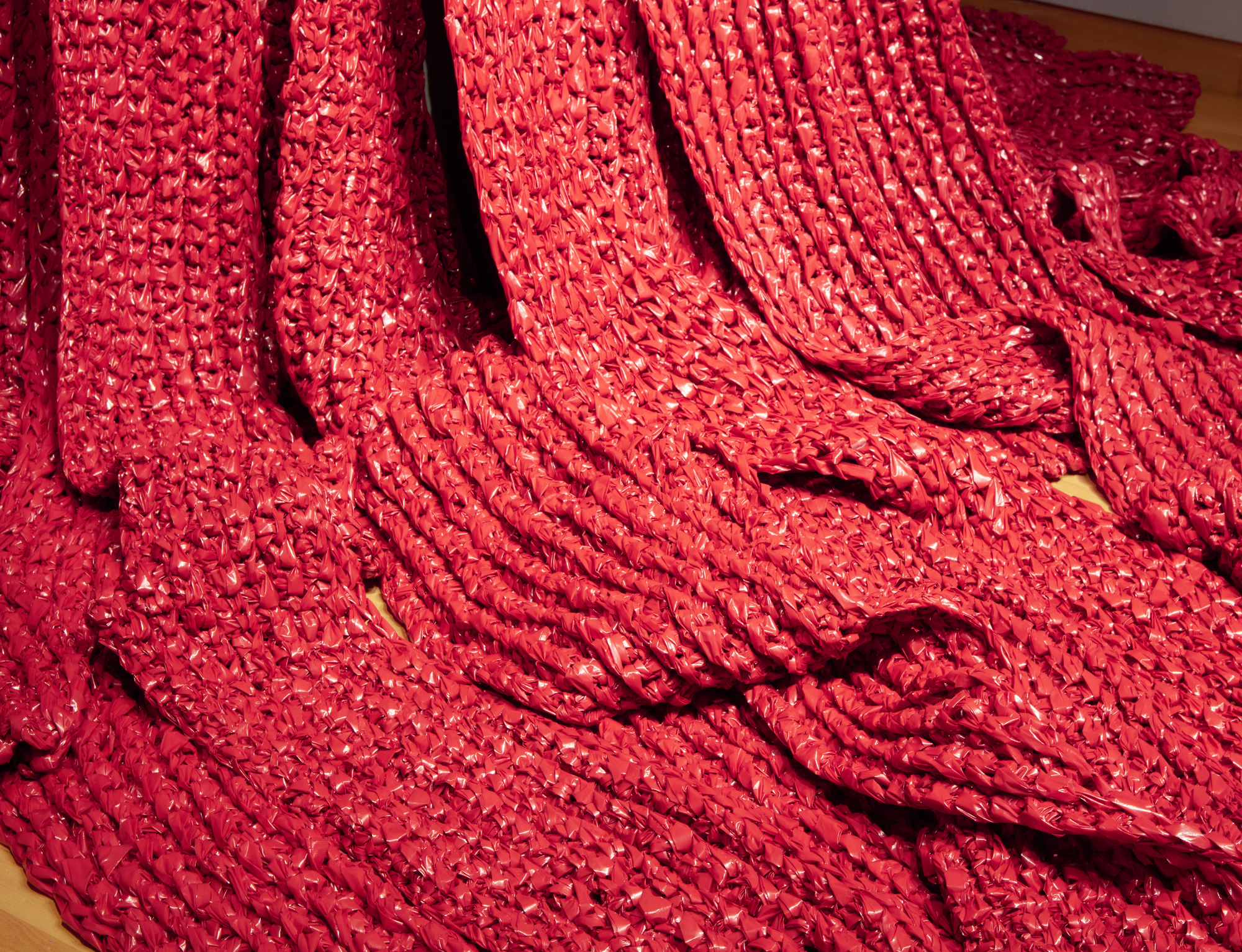 Akiko Kotani, Red Falls (detail), 2021. crocheted polyethylene, dimensions variable. Courtesy of the artist. Installation view of Skyway 20/21 exhibition at USF Contemporary Art Museum. Photo: Will Lytch.