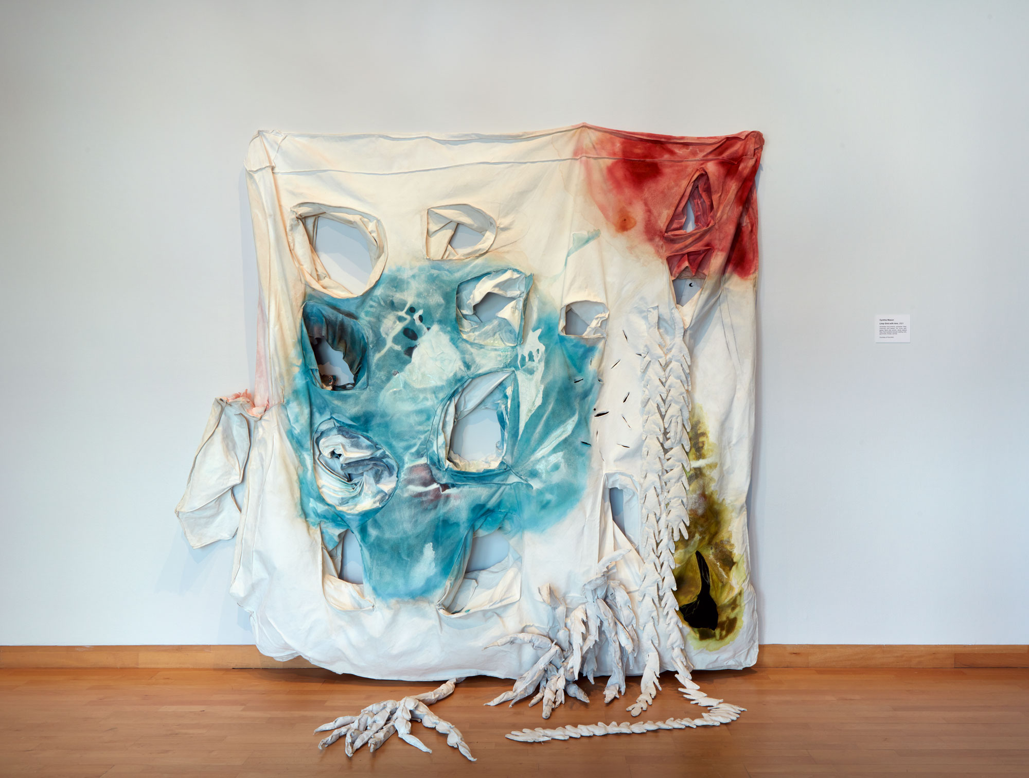 Cynthia Mason, Limp Grid with Arm, 2021. shredded documents, polyester fiber, charcoal, soft pastel, ink, mica, salt, gesso, fabric dye, acrylic, velvet, alpaca fiber, thermoplastic lacquer coating, wire, grommets, thread, canvas. 90 x 98 x 43 in. Courtesy of the artist. Installation view of Skyway 20/21 exhibition at USF Contemporary Art Museum. Photo: Will Lytch.