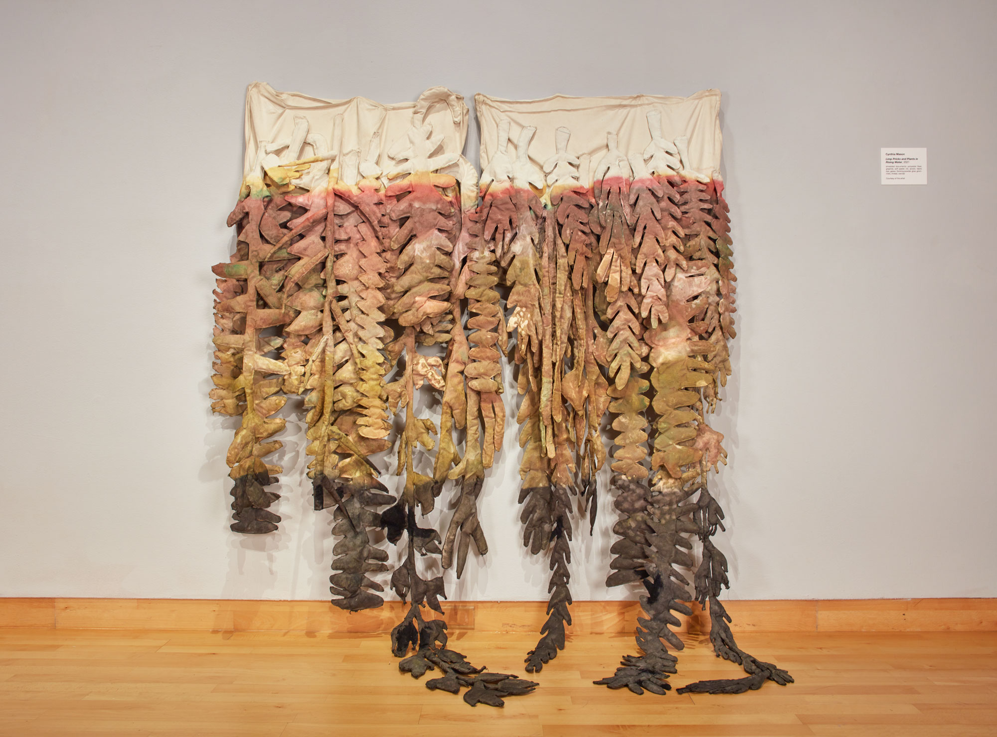 Cynthia Mason, Limp Pricks and Plants in Rising Water, 2021. shredded documents, polyester fiber, graphite, soft pastel, ink, acrylic, fabric dye, gesso, flocking powder, glue, grommets, thread, canvas. 68 x 64 x 25 in. Courtesy of the artist. Installation view of Skyway 20/21 exhibition at USF Contemporary Art Museum. Photo: Will Lytch.