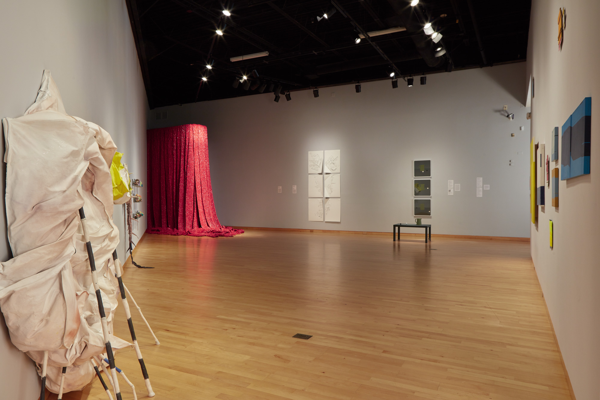 Installation view of Skyway 20/21 exhibition at USF Contemporary Art Museum. Left to right: works by Cynthia Mason, Kodi Thompson, Akiko Kotani, Rosemarie Chiarlone, Ry McCollough, and Babette Herschberger. Photo: Will Lytch.