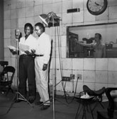 Griffith J. Davis. Griff Davis reviews the script for Liberia's first promotional film "Pepperbird Land"with its narrator, emerging actor Sidney Poitier in Monrovia, Liberia, 1952. Griffith J. Davis Photographs and Archives.